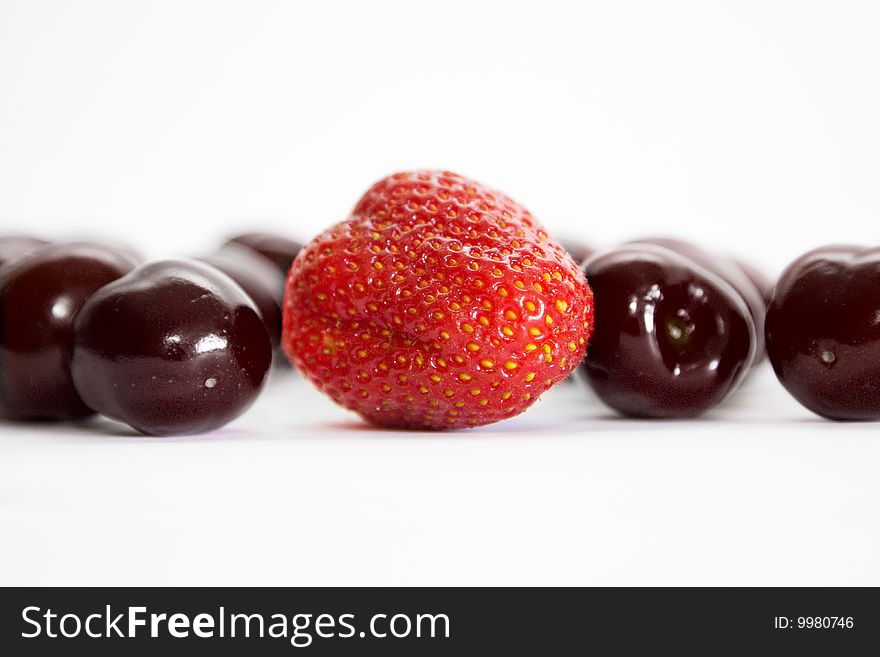 Mixed berries - strawberries, cherry on white. Mixed berries - strawberries, cherry on white
