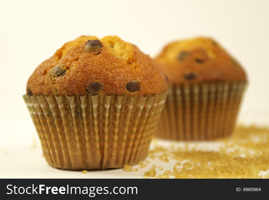 Two muffins with chocolate flakes