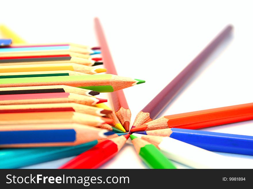 Colorful pencils on white background.
