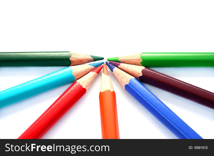 Colorful pencils on white background.