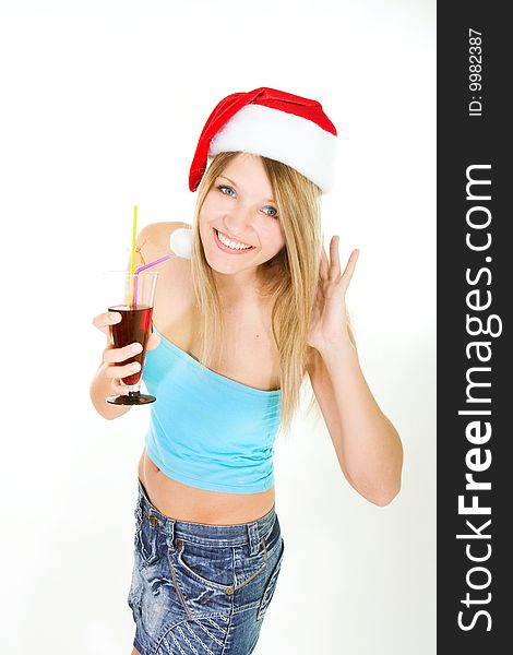 Santa girl with glass of juice over white