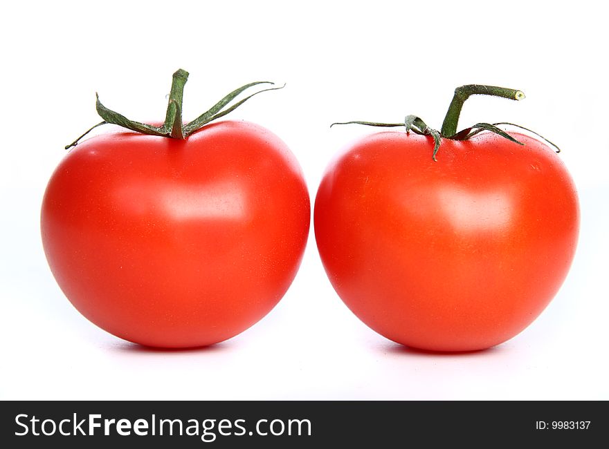 Two big red tomatoes on the table