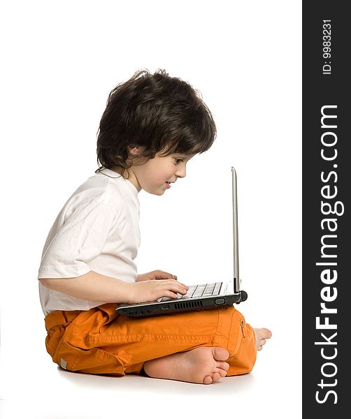 The merry boy with laptop on white background