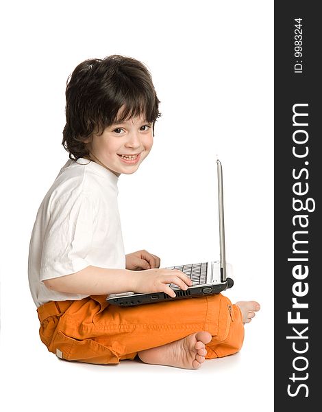 The merry boy with laptop on white background