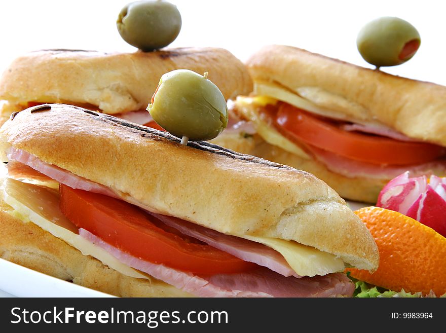 Sandwich with fresh vegetables on white plate