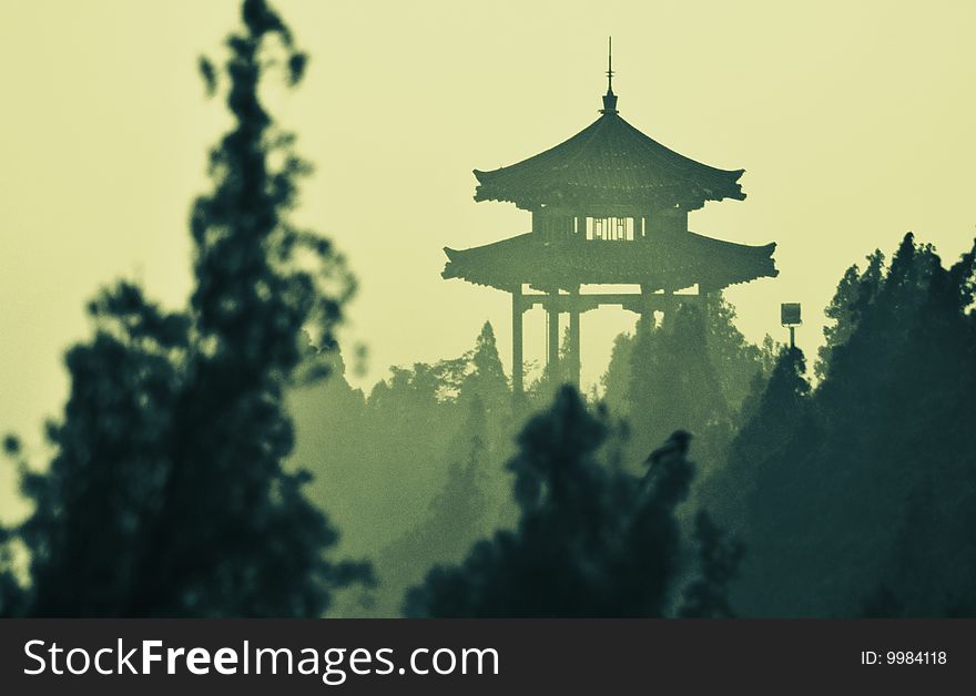 Pavilion in mist on the top of Qianfo Mountainï¼ŒChinaï¼Œlike the drawing with ink