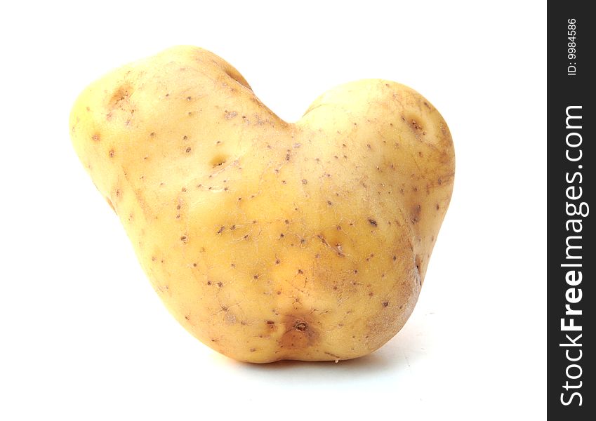 Shot of a heart shaped potato on white. Shot of a heart shaped potato on white