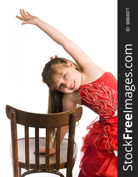 An image of a nice girl with brown chair. An image of a nice girl with brown chair