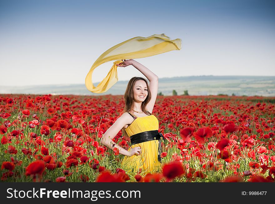 Attractive Girl In The Poppy Field