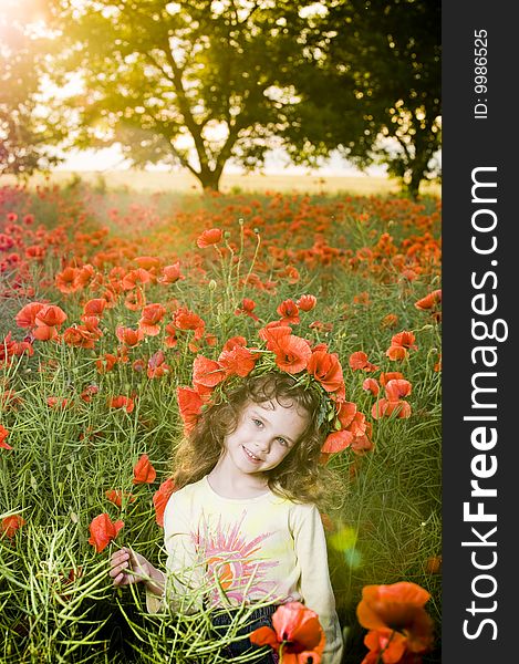 Smiling Little Girl In The Poppy Field