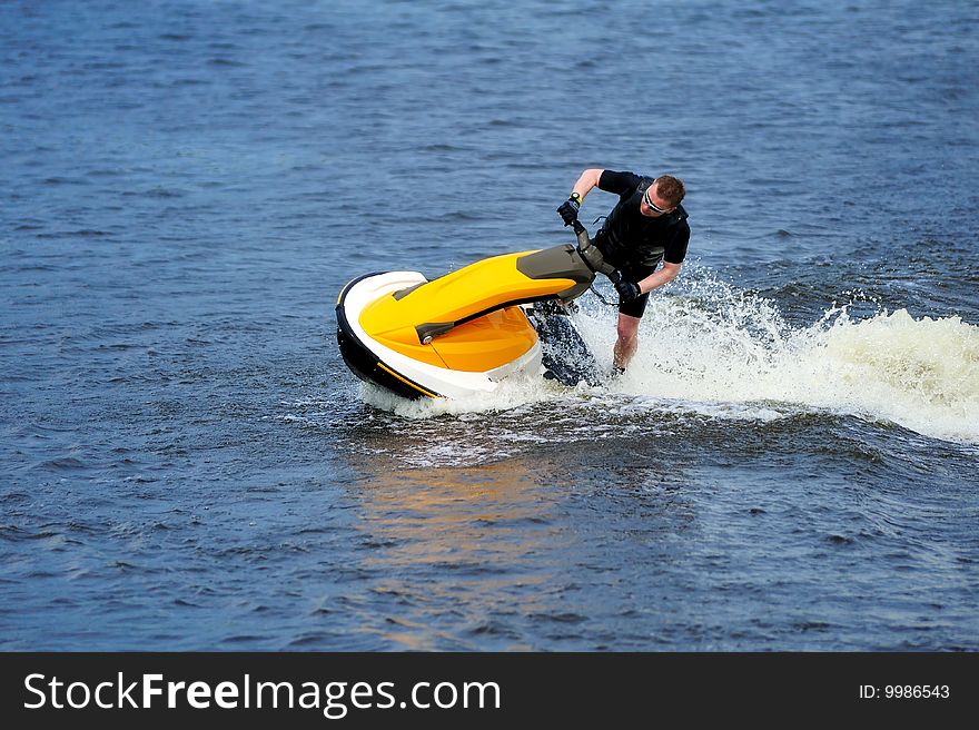 Young Man Riding Jet Ski