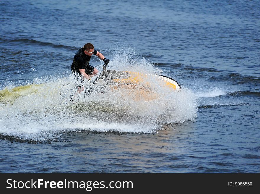 Young Man Riding Jet Ski