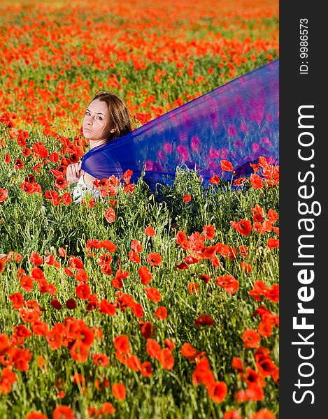 Sensual girl with blue scarf in the poppy field. Sensual girl with blue scarf in the poppy field