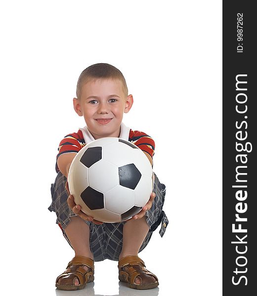 Young boy holding football in his hand. Young boy holding football in his hand