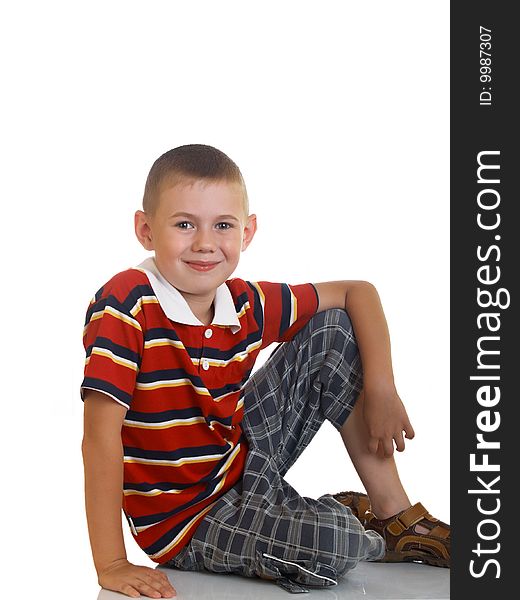Portrait of the boy sitting on a floor. Portrait of the boy sitting on a floor