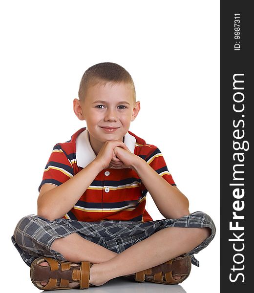Portrait of the boy sitting on a floor. Portrait of the boy sitting on a floor