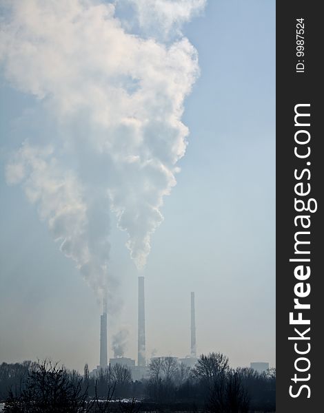 Smoking power plant chimneys polluting the air
