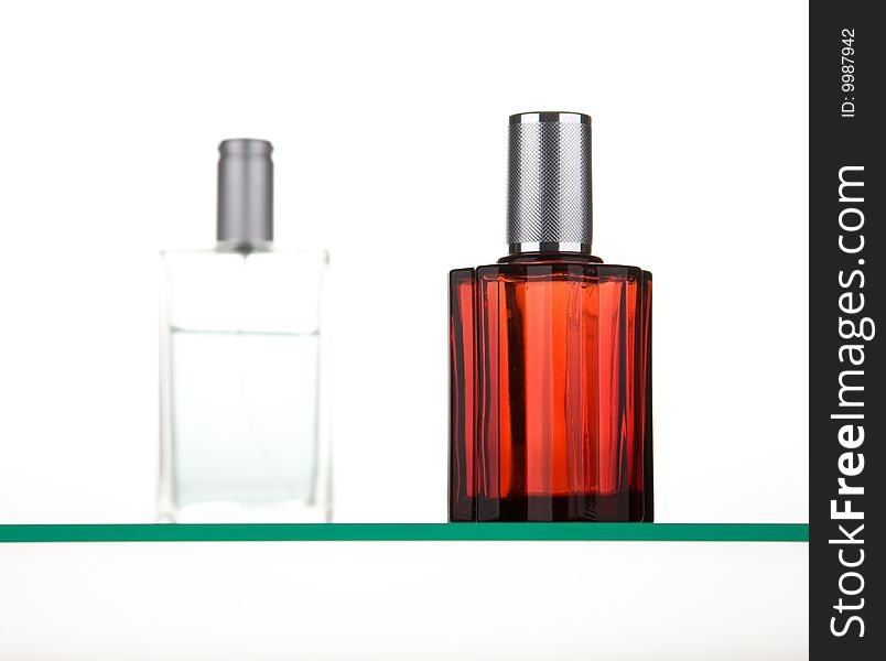 White and red  man perfume bottles