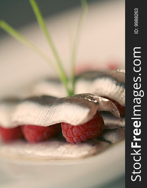 Anchovies  sandwich with red raspberries. Anchovies  sandwich with red raspberries