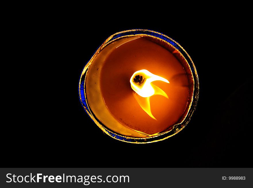 Flame of a candle against a black background