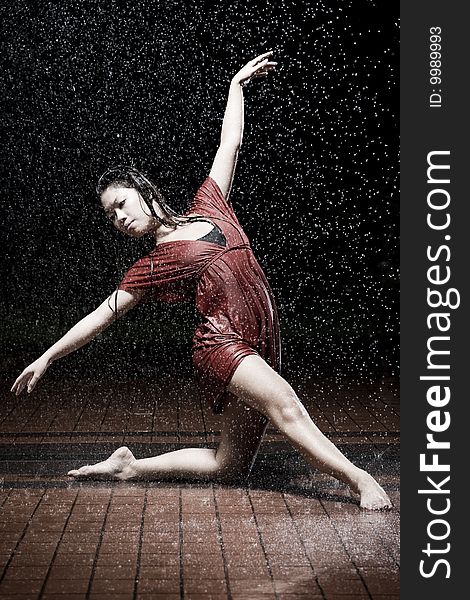 Ballet dancer dancing in the rain. Ballet dancer dancing in the rain