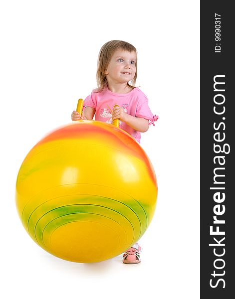 Little girl and big yellow ball on white background