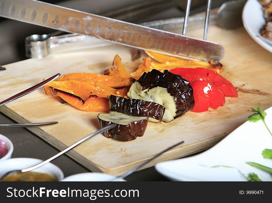 Chef cutting vegetables looking front