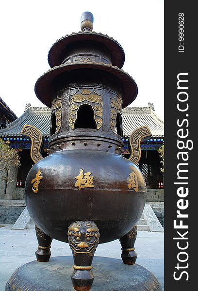 A Three-legged ancient Chinese vessel in a temple