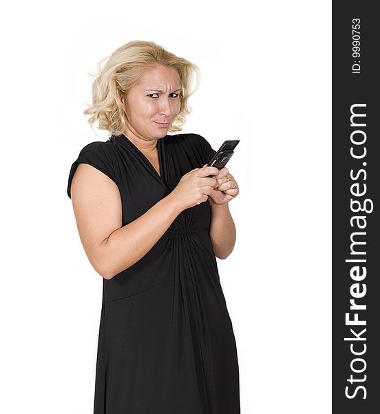 A women holding a mobile phone smiling. A women holding a mobile phone smiling