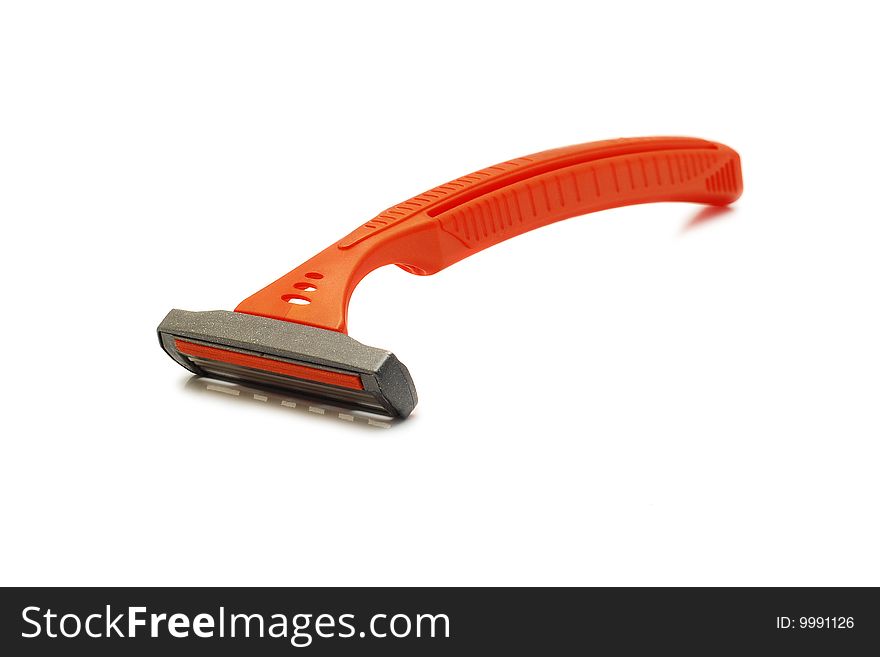 Orange plastic razor isolated on white