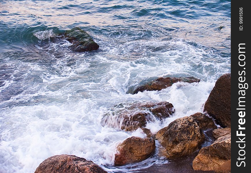 Coast of Black sea with a running wave