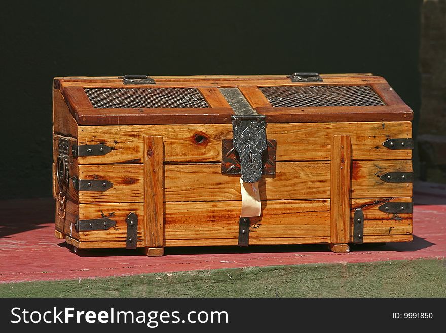 A wooden yellowwood chest used to store linen and clothing
,