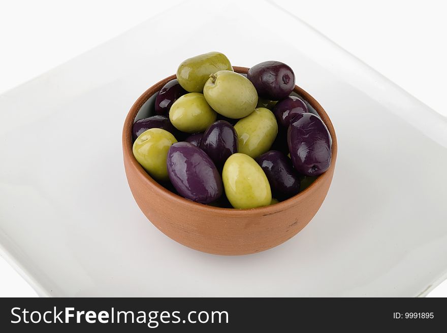 Small casserole ceramic and olives isolated in white background