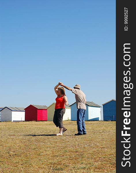 Couple dancing together at the beach