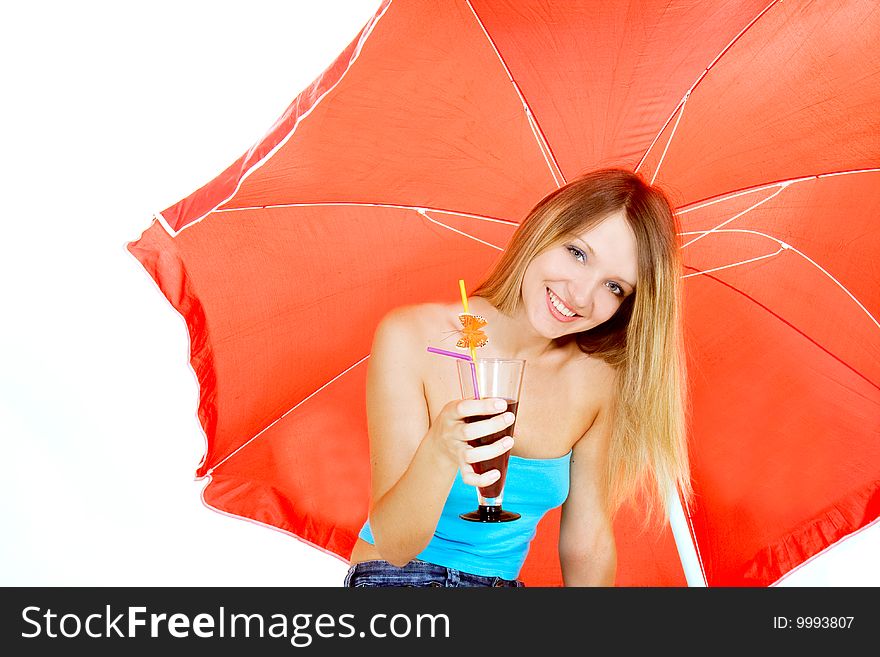 Attractive girl with glass of juice under red umbrella over white