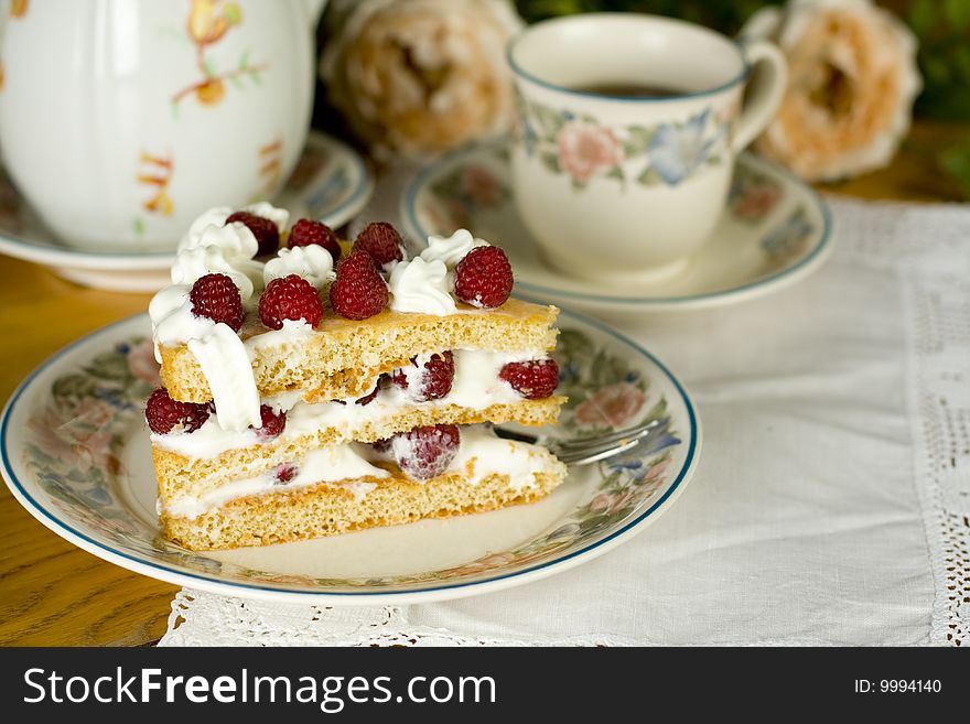 Raspberry cake served with  tea. Raspberry cake served with  tea