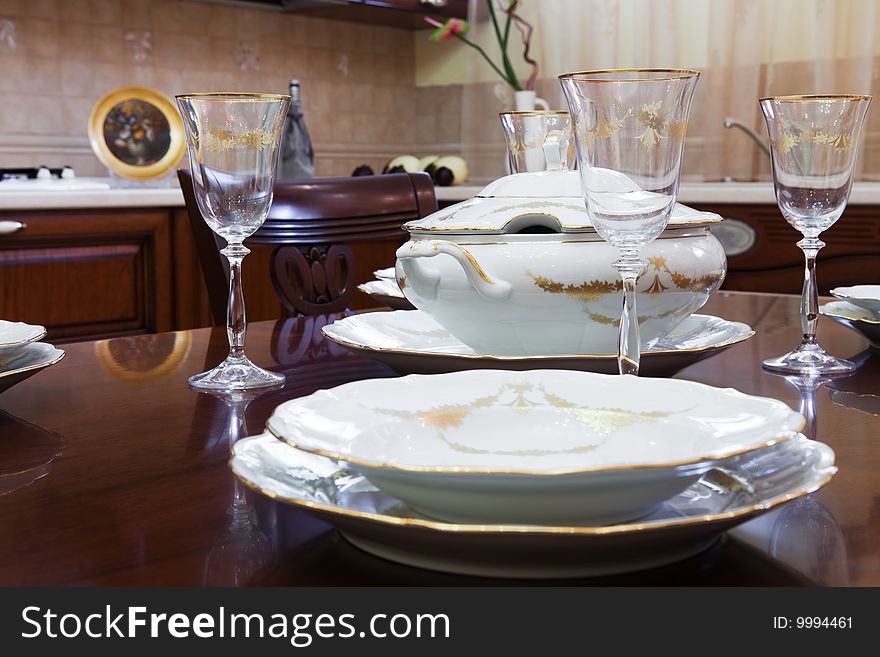 Glasses and plates on a wooden table