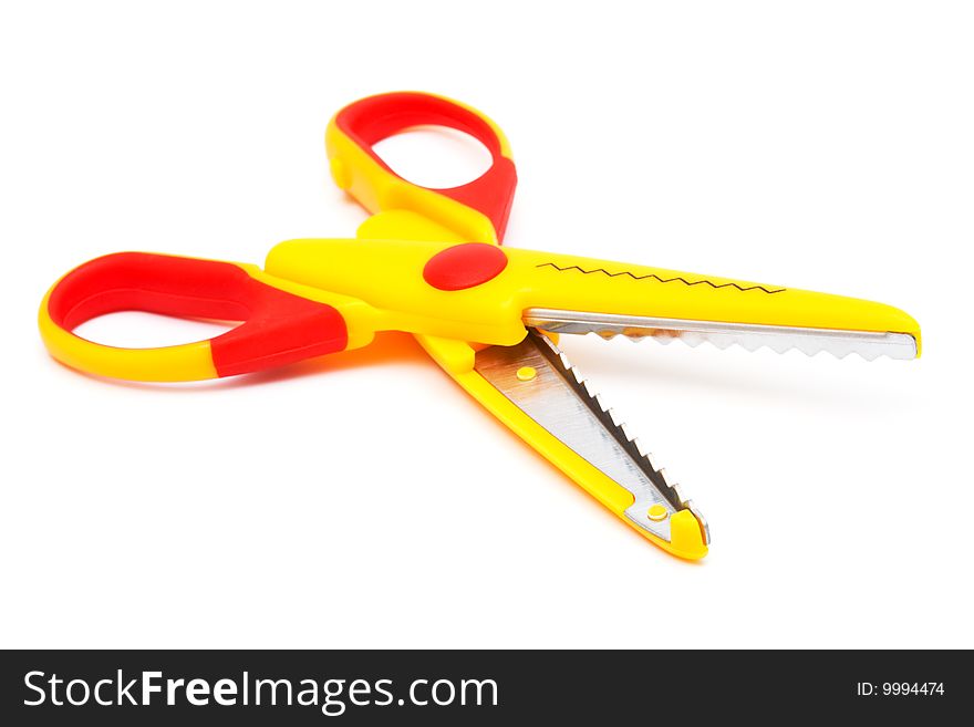 Modern yellow scissors on a white background