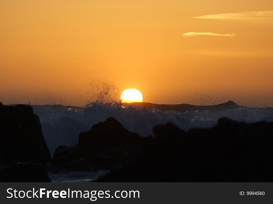 This sunset was taken in Monterey, CA, with the waves crashing against the rocks in the foreground. This sunset was taken in Monterey, CA, with the waves crashing against the rocks in the foreground.