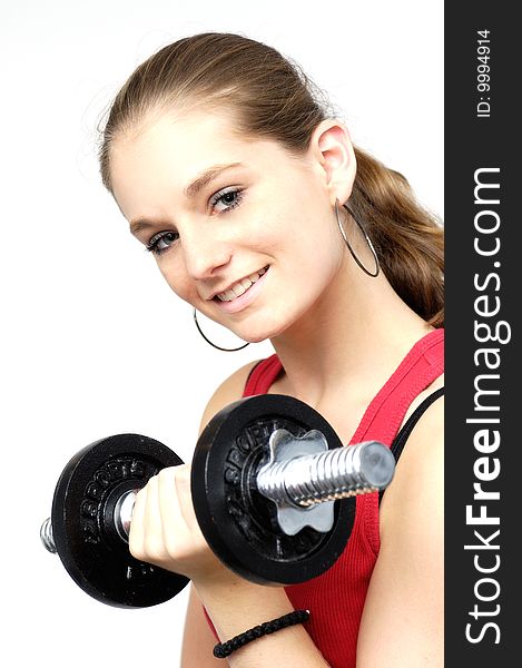 Young woman in red sport shirt with dumbbell. Young woman in red sport shirt with dumbbell