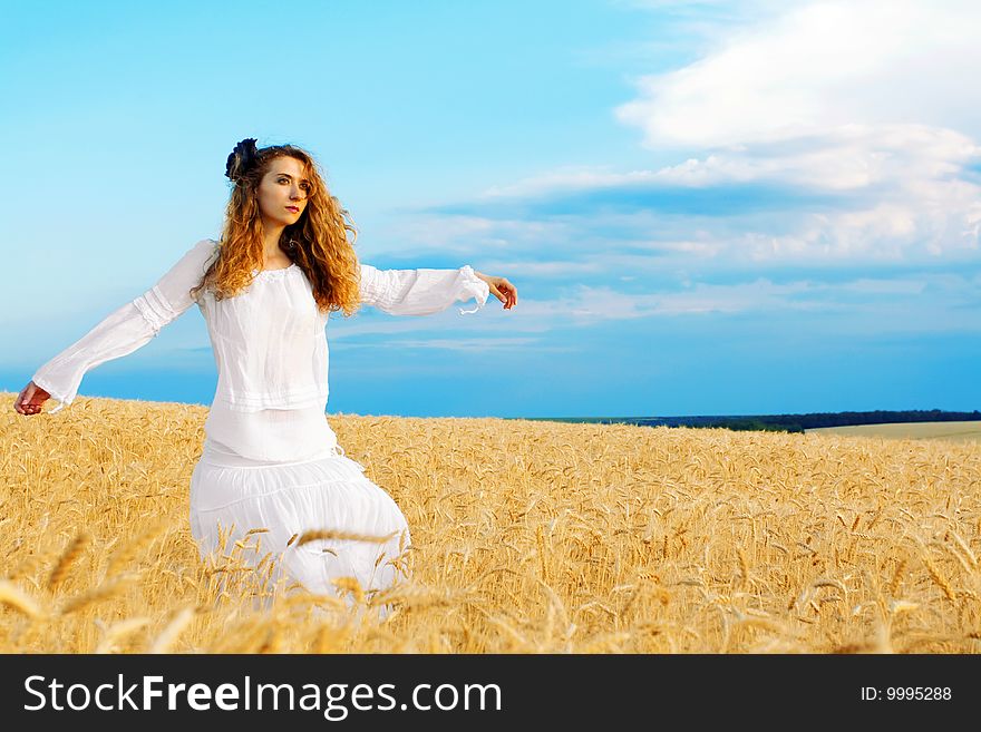 Woman in wheat field at sunset. Woman in wheat field at sunset