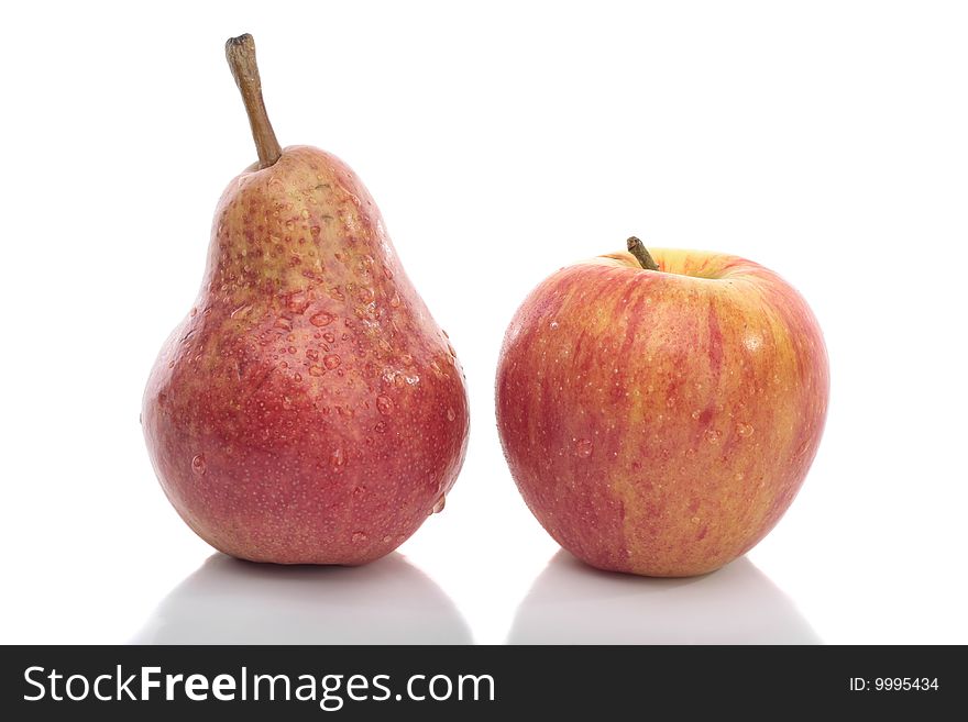 Red pear and apple isolated over white background. Red pear and apple isolated over white background