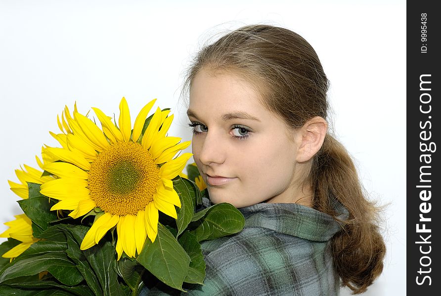 Young woman in green shirt with sunflower. Young woman in green shirt with sunflower