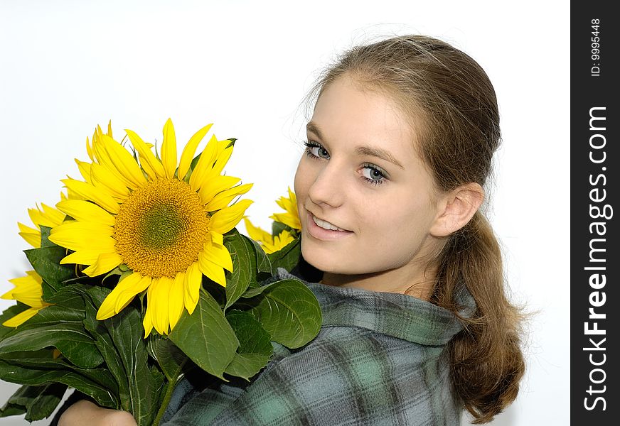 Pretty young gardener woman with sunflowers. Pretty young gardener woman with sunflowers