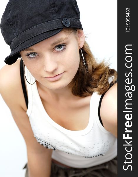 A young woman with black cap