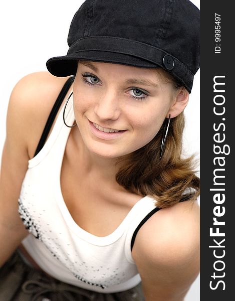 A young woman with black cap and white Top