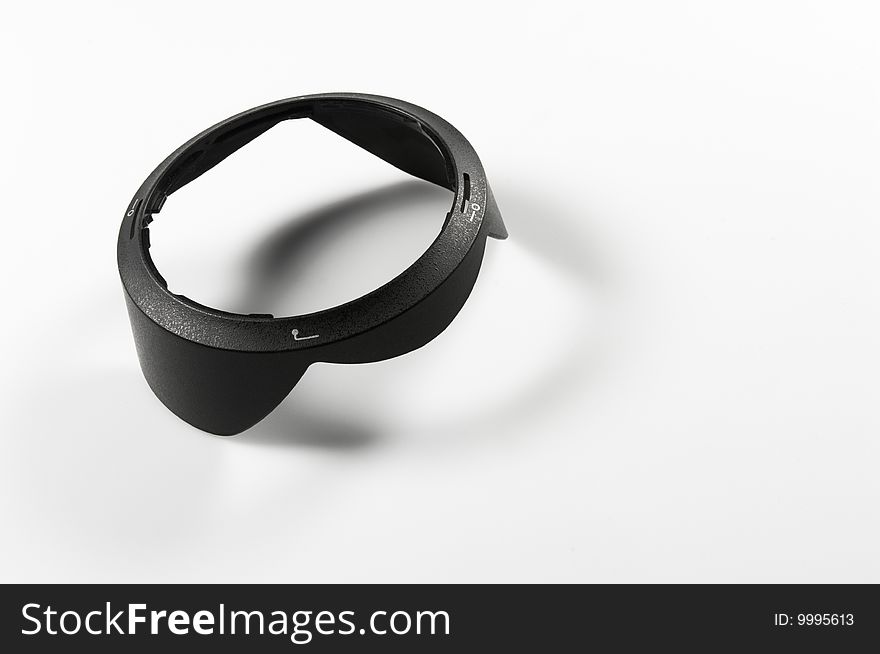 Lens hood of an photo camera on white ground