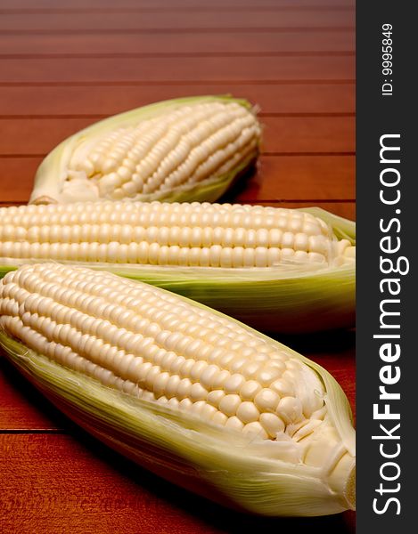 Close up of three cobs on corn
