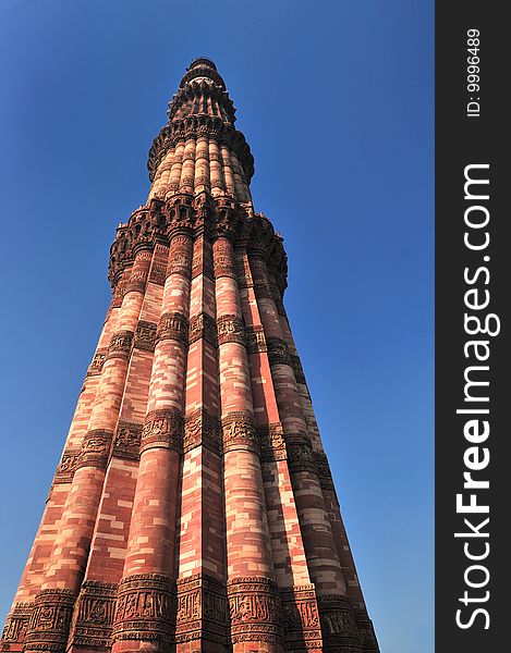 The tower Qutub Minar is the tallest brick minaret in the world. Delhi, India. The tower Qutub Minar is the tallest brick minaret in the world. Delhi, India