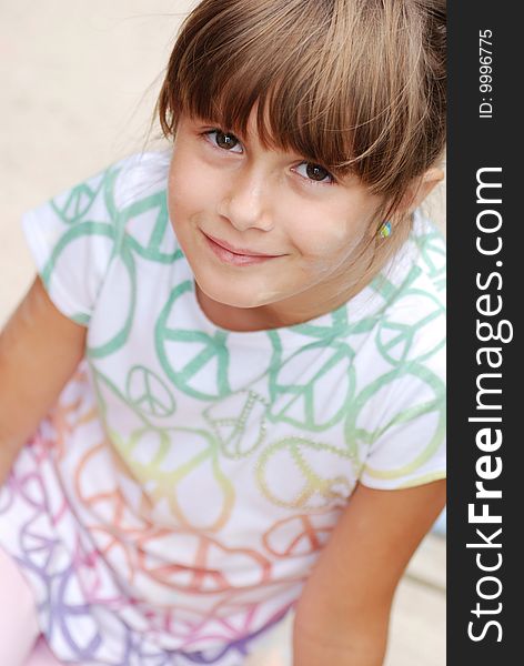 A cute girl with chalk on her face